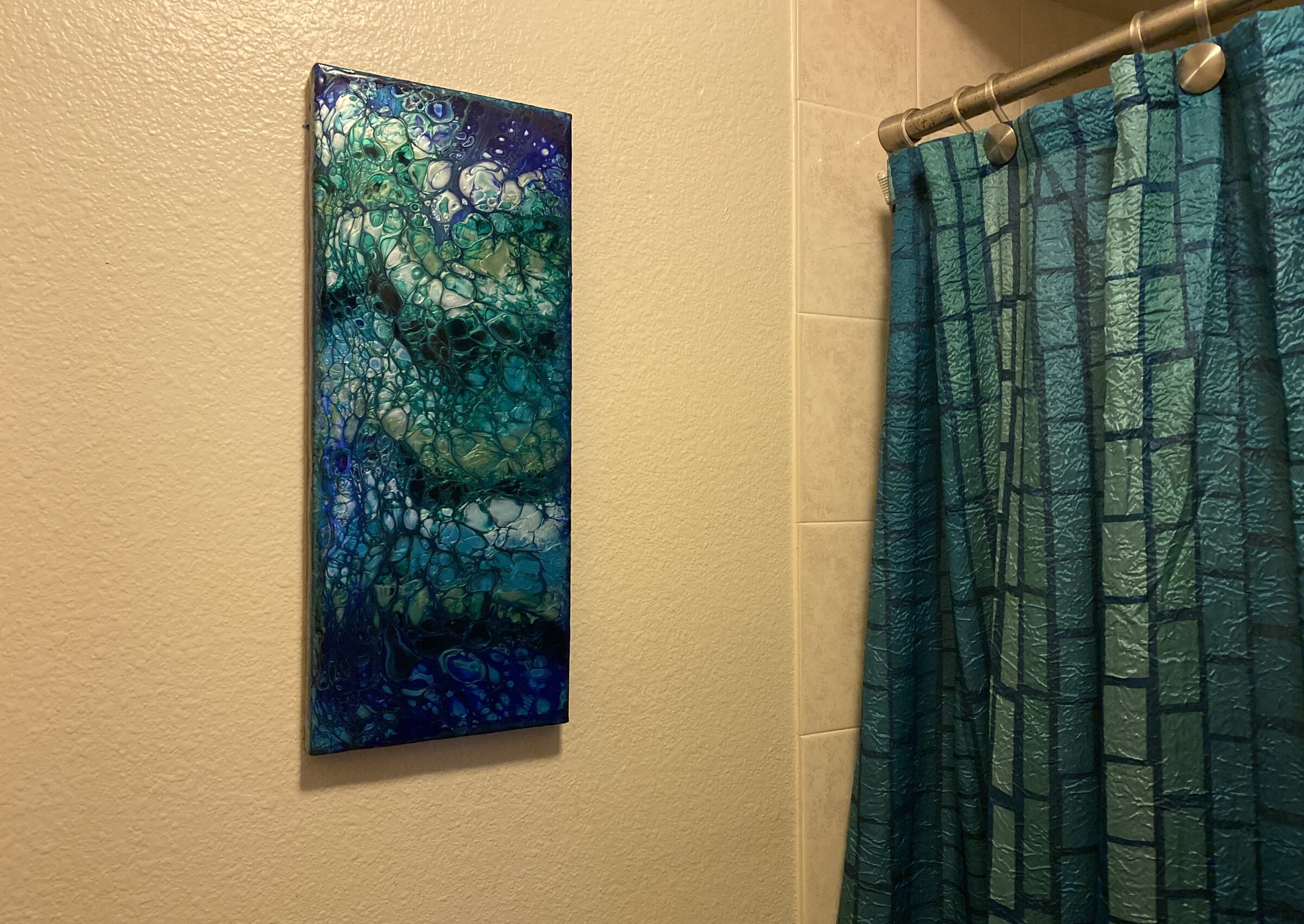 Across the Room hanging beside the shower curtain that inspired it