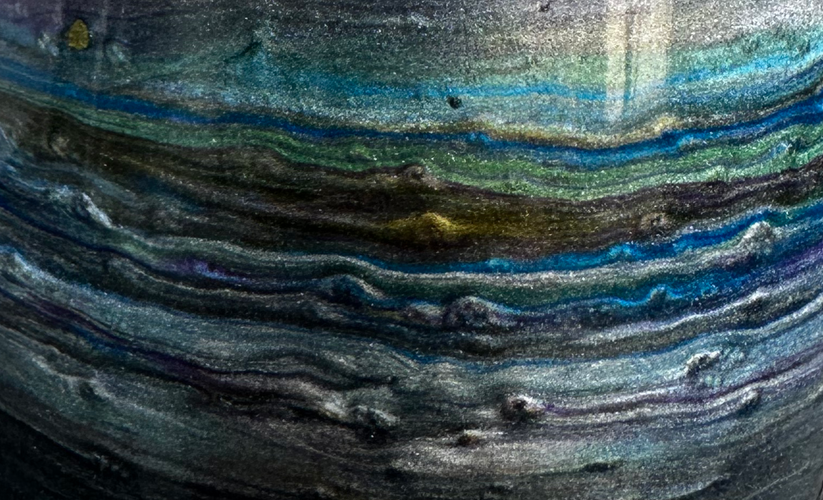 Close-up of the geological banding on the resin cup surface