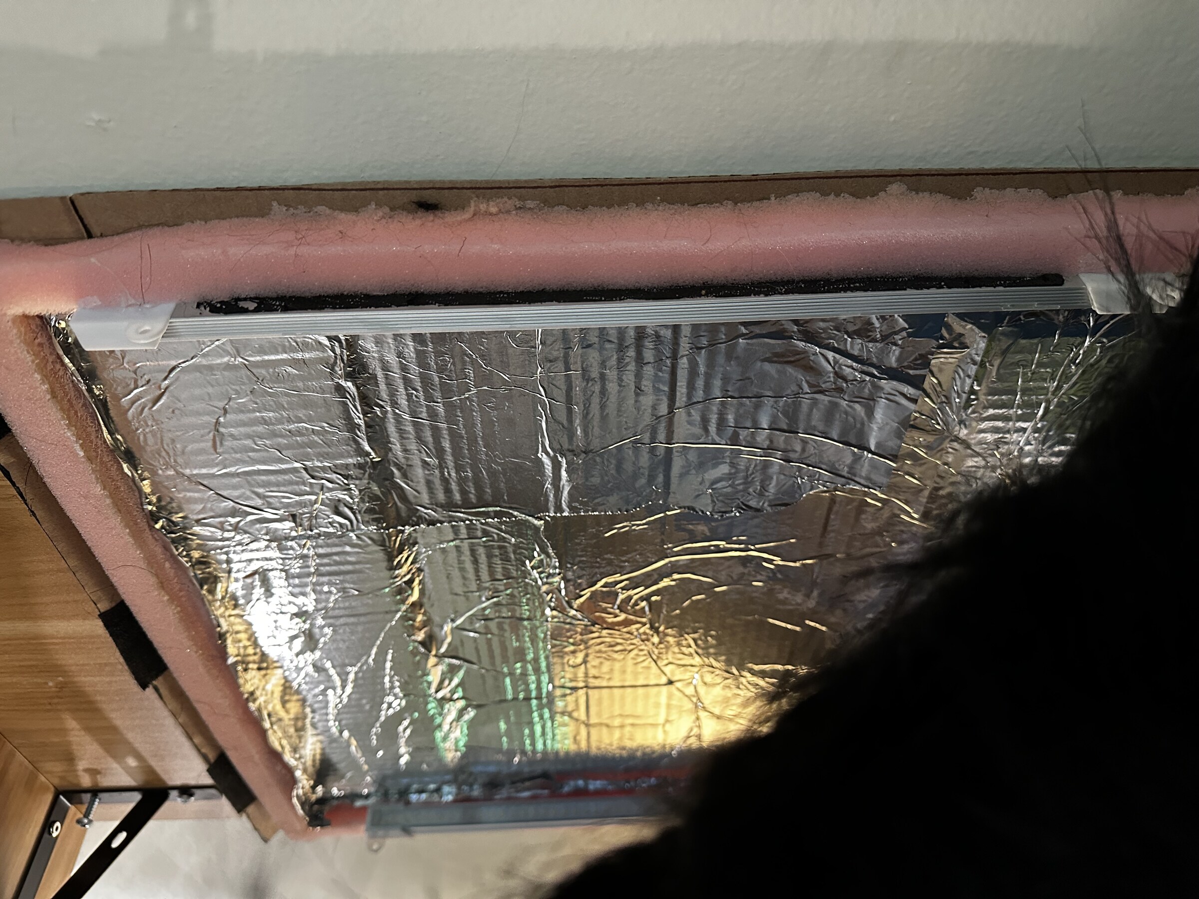 Interior of the Pax et Amor box showing foil lining, foam packing, and LED strip