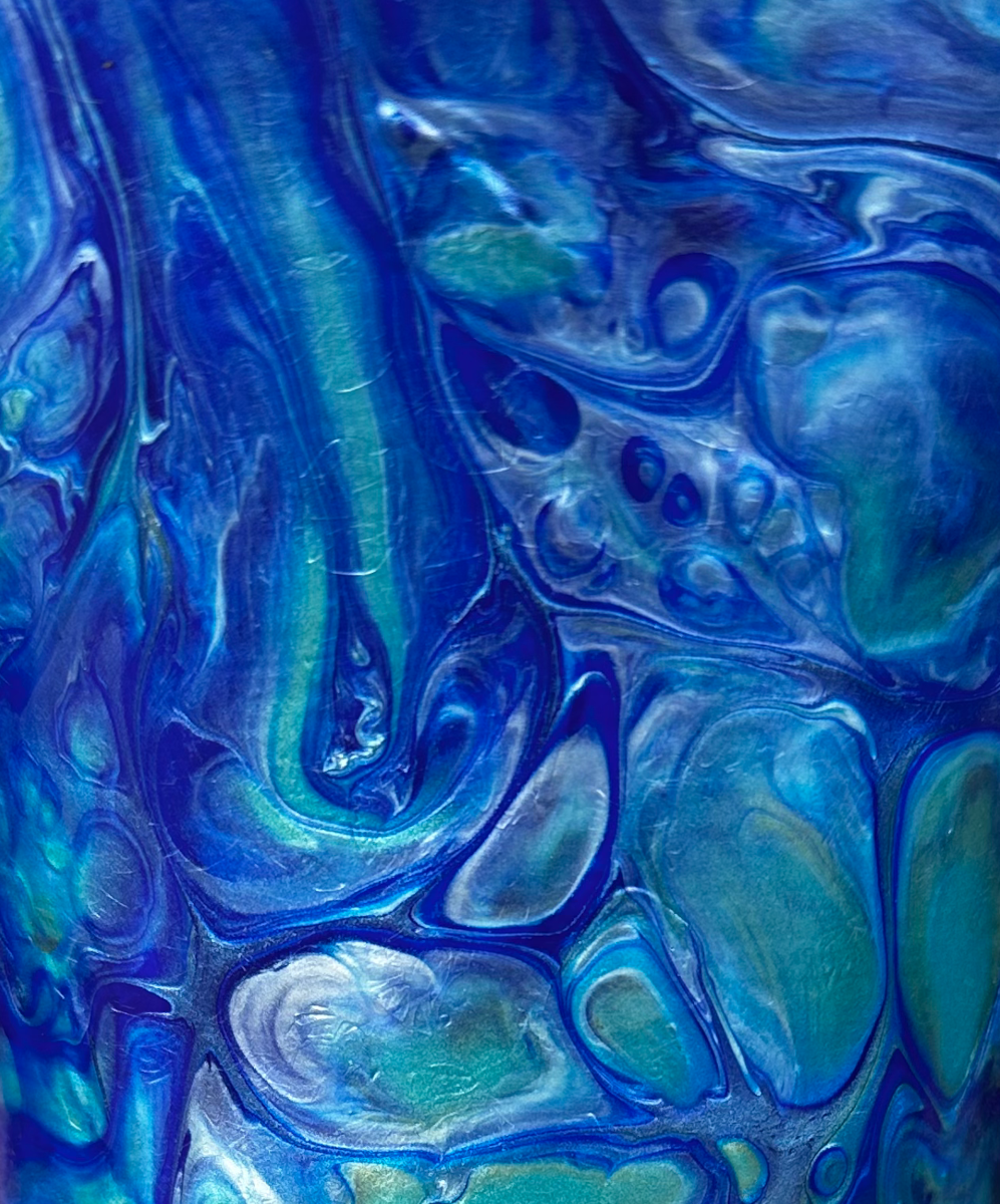 Close-up of the office vase surface — large cobalt and teal cell formations